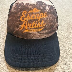 Escape Artist Trucker Hat - Brown & Black with Orange Logo